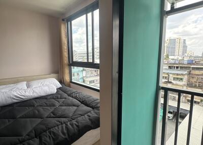 Bedroom with a view of the city