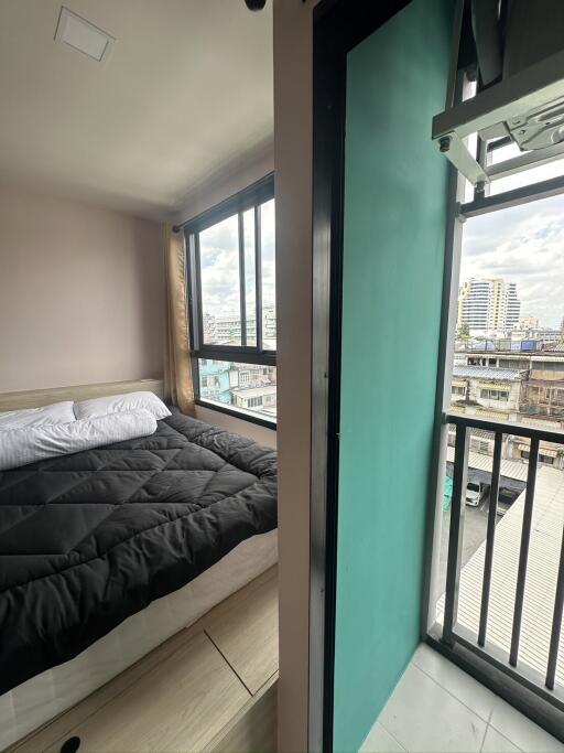 Bedroom with a view of the city