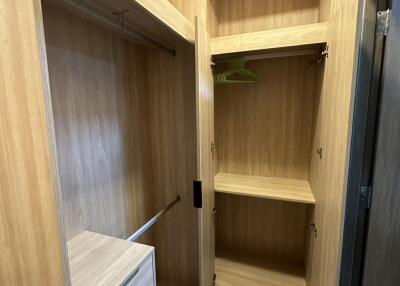 Wooden closet with open and closed storage spaces