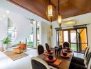 Modern dining area with stylish lighting and a view of a spiral staircase