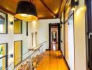 Spacious hallway with wooden flooring and large windows