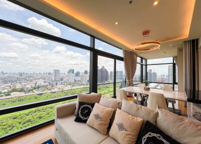 Modern living room with large windows providing a panoramic city view