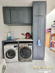 Laundry room with washing machine and dryer