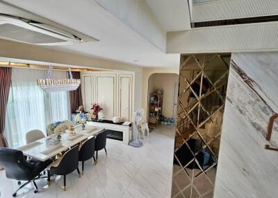 modern dining room with chandelier and marble flooring