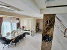 modern dining room with chandelier and marble flooring