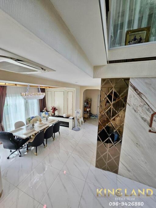 modern dining room with chandelier and marble flooring