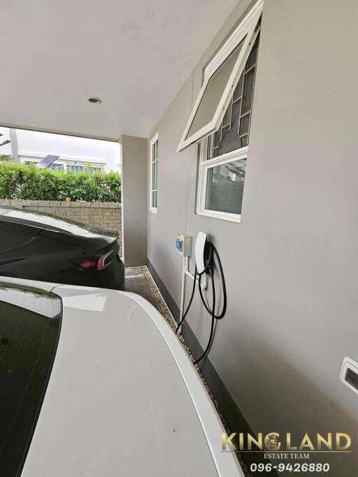 Carport with electric vehicle charging station