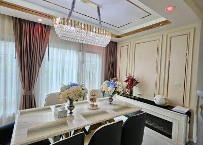 Elegant dining room with a chandelier and modern furnishings