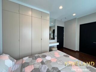 Spacious and modern bedroom with large closet and comfortable bed