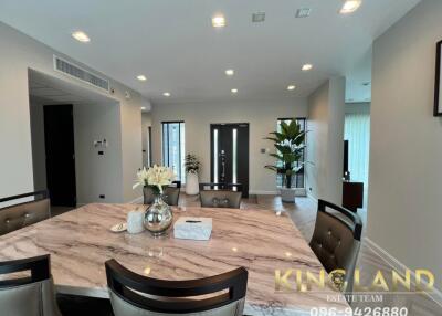 Modern dining room with marble-top table and decor