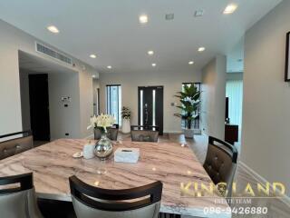 Modern dining room with marble-top table and decor