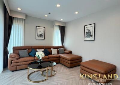 Cozy living room with leather sectional sofa and stylish decor