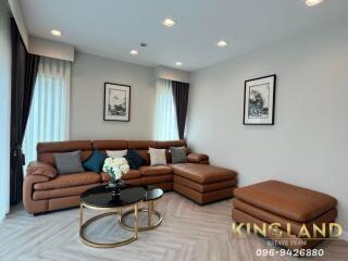 Cozy living room with leather sectional sofa and stylish decor