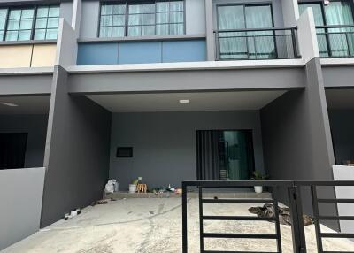 Modern townhouse exterior with gated porch