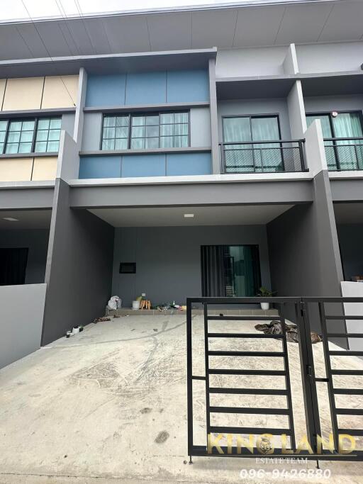 Modern townhouse exterior with gated porch