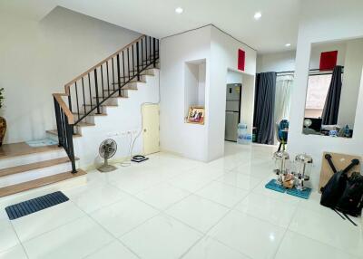 Spacious living room with a staircase