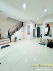 Spacious living room with a staircase