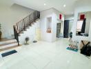 Spacious living room with a staircase