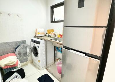 Laundry area with appliances and storage space