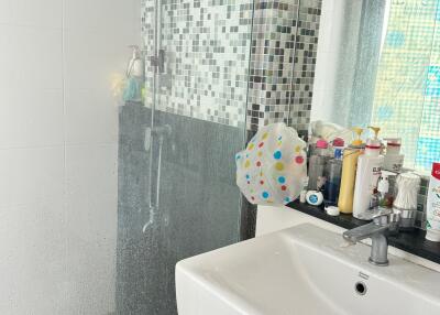 Modern bathroom with sink and shower area