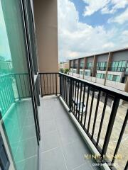 Modern balcony with railing and view of neighboring buildings