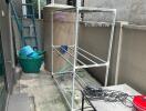 Outdoor utility space with storage and drying rack