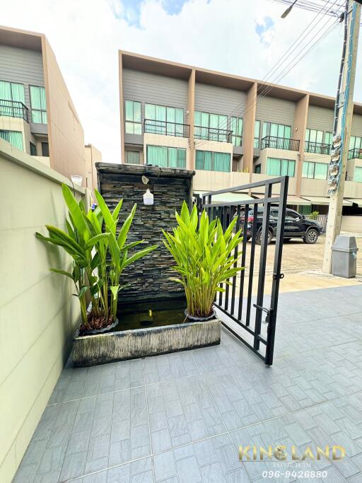 Outdoor area with gate and water feature