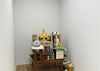 Room showing religious altar with various items