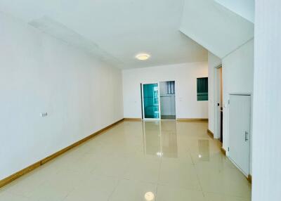 Spacious minimalist living room with tiled floor