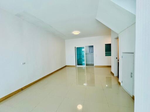 Spacious minimalist living room with tiled floor