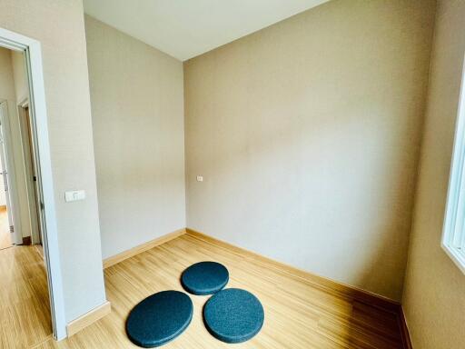 Empty bedroom with round floor cushions