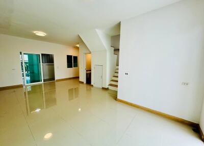 Spacious living room with staircase