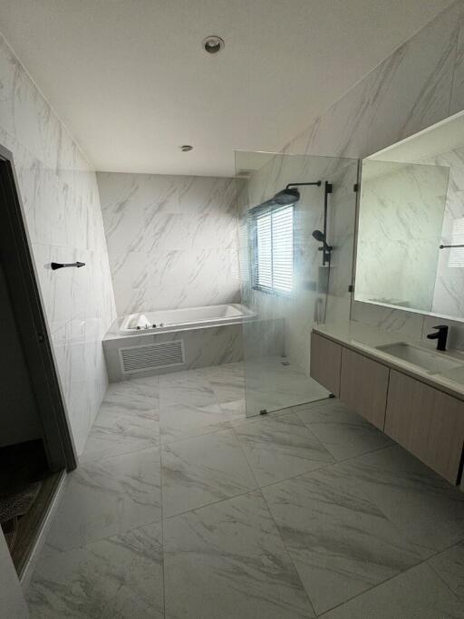 Modern bathroom with bathtub and shower