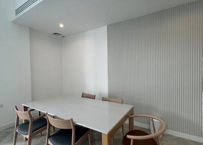 Modern dining area with wooden table and chairs