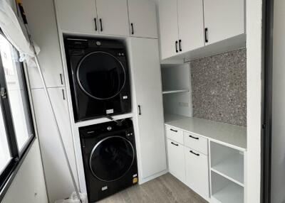 Modern laundry room with washer and dryer