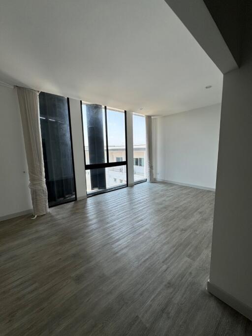 Spacious living room with large windows