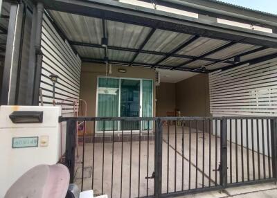 Covered carport with gate