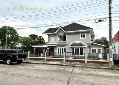 Two-story house with driveway and front yard