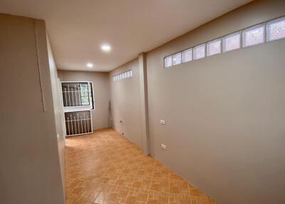 Empty room with tiled floor and windows