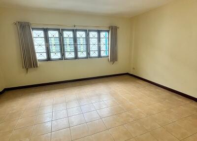 Spacious empty bedroom with natural light