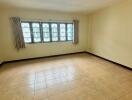 Spacious empty bedroom with natural light