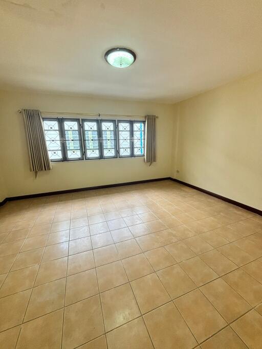 Spacious empty bedroom with natural light