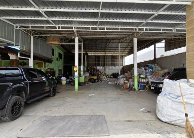 A spacious garage or storage area with trucks parked inside