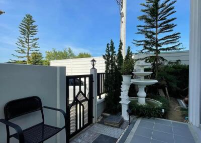 Outdoor area with gate and fountain