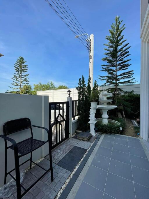 Outdoor area with gate and fountain