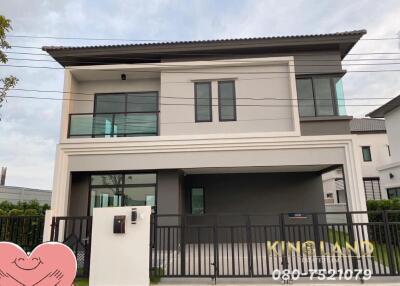 Modern two-story house with fenced yard