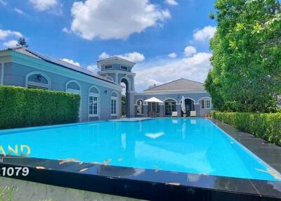 Exterior view of a luxury house with a swimming pool