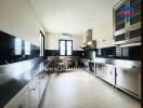 Modern kitchen with stainless steel appliances and countertops