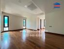 Spacious and bright living area with hardwood floors