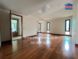 Spacious main living area with wooden flooring